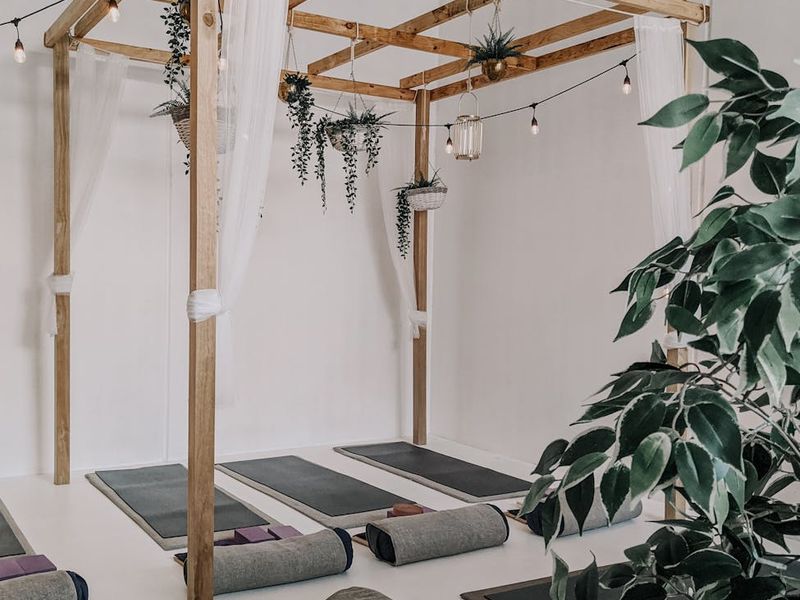 Serene atmosphere with yoga mats and soft lighting.